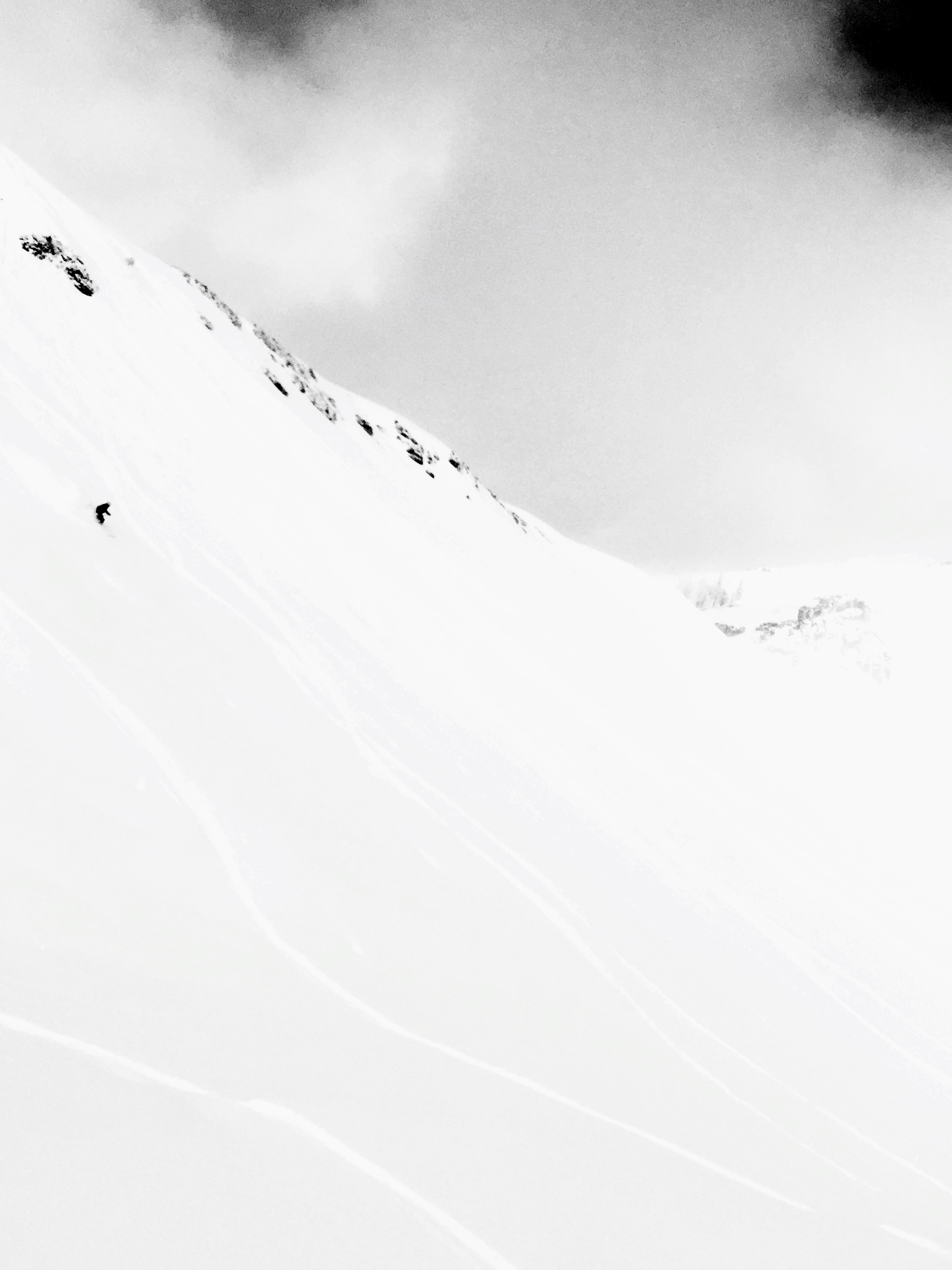 Solo skier on open face